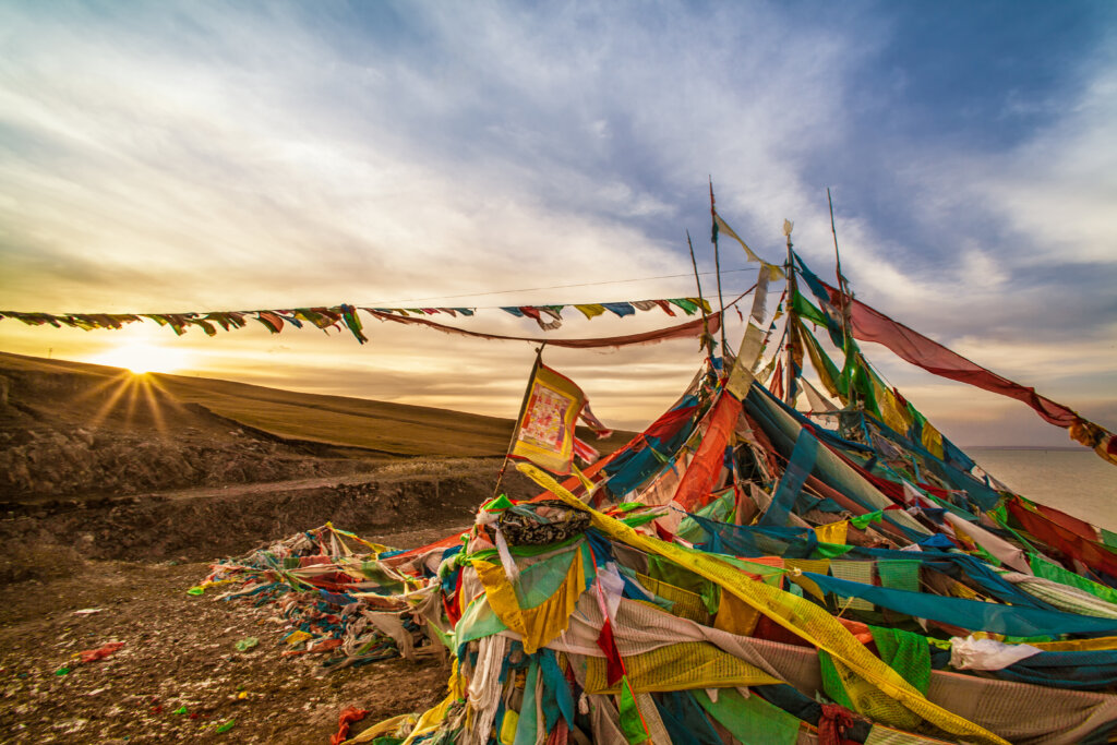 Prayer flags at Qinghai Lake with beautiful sunset