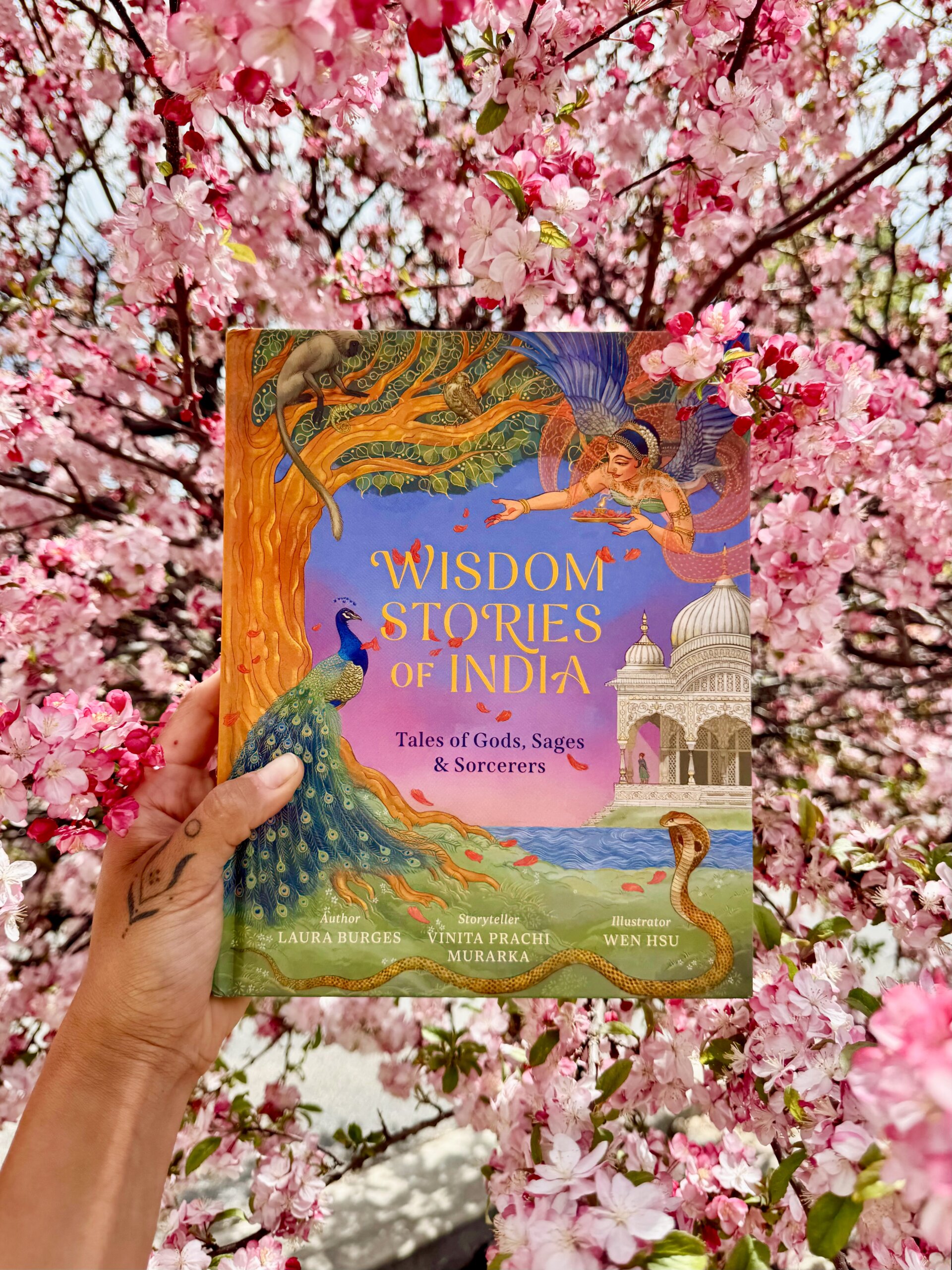 Wisdom Stories of India Book Cover with a background of pink tree blossoms